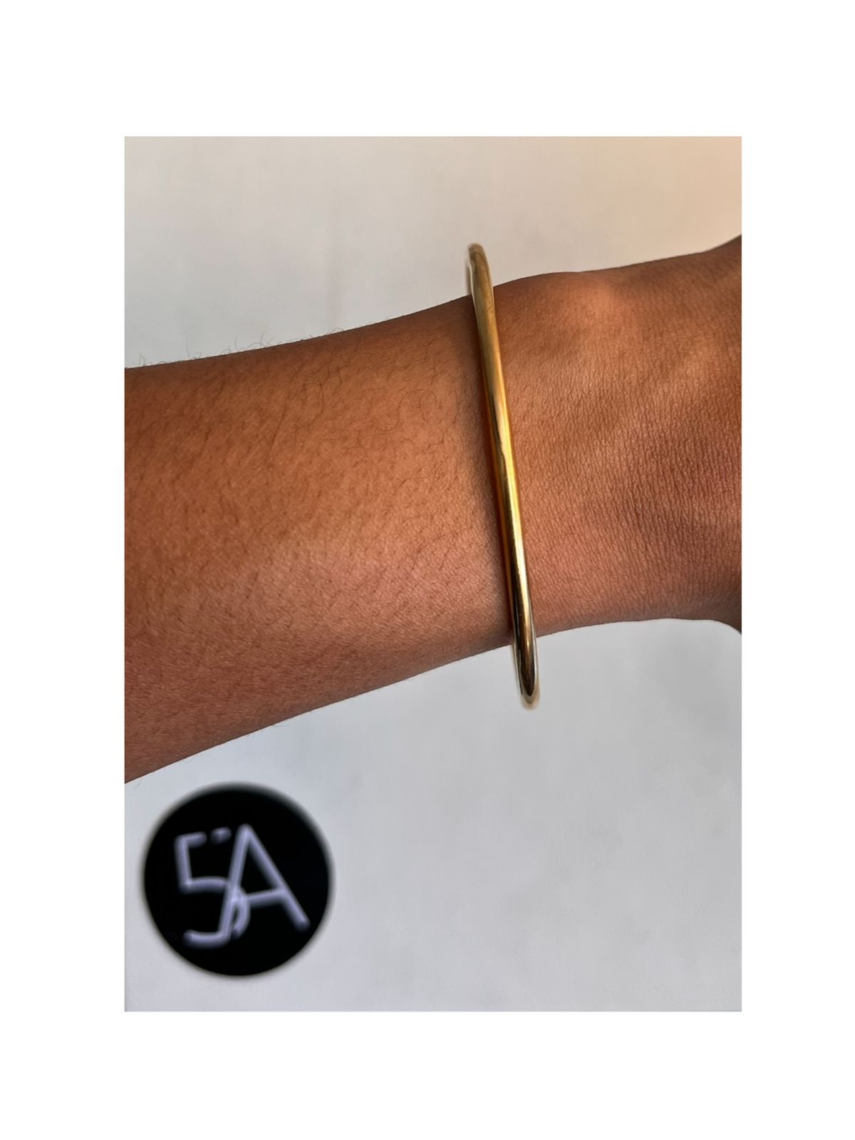 Pulsera Dorada Lisa Enchapada en oro 18k.