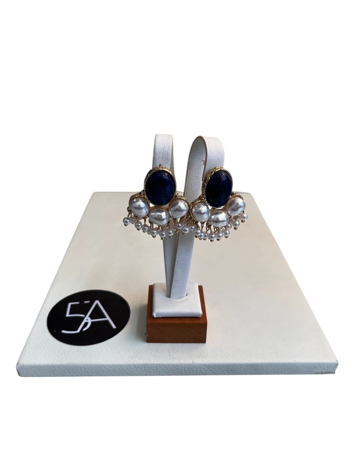 Aros con piedra azul y perlas